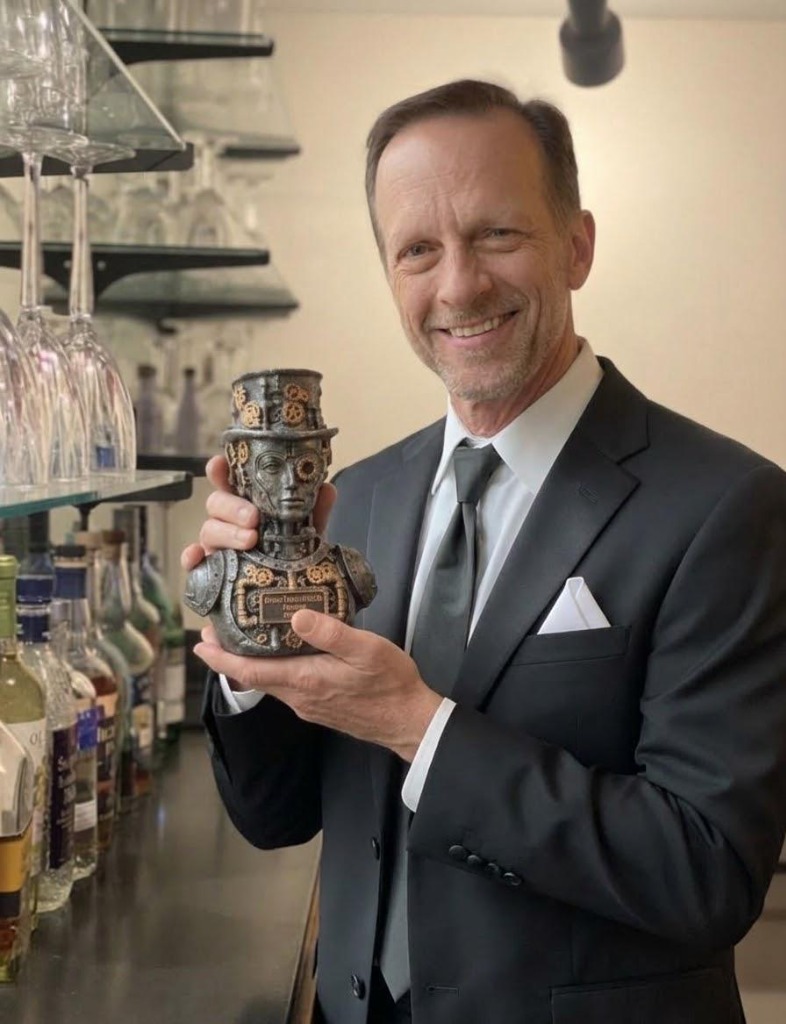 Dr. Jerry Heise holding the MIP trophy